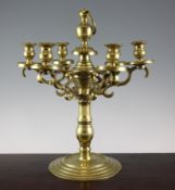 An 18th century Dutch six light brass candelabrum, with ring handle and scroll branches, 16in.