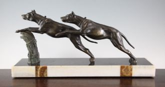 Limousin. An Art Deco bronzed spelter group of two leaping hounds, on signed marble plinths, 20in.