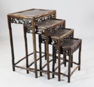 A nest of Chinese quartetto tables, with vineous pierced friezes, 1ft 8in. H.2ft 4in.