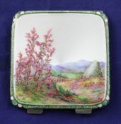 An Edwardian engine turned silver and enamel compact by The Goldsmiths & Silversmiths Co Ltd, of