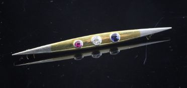 An Edwardian 15ct gold and platinum, sapphire, ruby and diamond set bar brooch, of elliptical