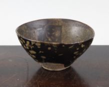 A Chinese blackware `paper cut` teabowl, Song/Jin dynasty, the interior decorated with four square