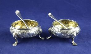 Two George II silver bun salts, with later embossed decoration, on hoof feet, Edward Wood, London,