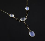 An Edwardian gold and moonstone drop pendant necklace, set with four cabochon cut stones, pendant