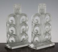 A pair of Lalique `Volutes` glass candlesticks, with original green staining, etched mark R.Lalique,