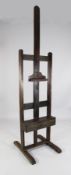 A stained beech easel, with box drawer, 1ft 10in. H.7ft