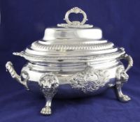A good George III silver oval two handled soup tureen and cover, with gadrooned and shell border and