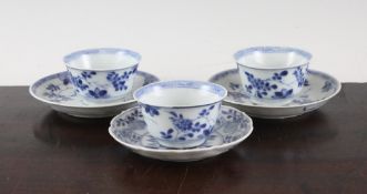 Three Chinese blue and white floral teabowls and two saucers, and another saucer, Kangxi period,