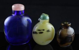 Two Chinese plain agate snuff bottles and a Chinese blue glass snuff bottle 4.7cm - 7cm