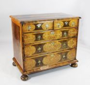 An early 18th century oyster veneered and walnut marquetry inlaid chest, the top with oval inlaid