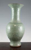 A Chinese Longquan celadon yen-yen vase, 15th / 16th century, carved in relief with flowers, 17.