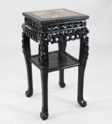 A 19th century Chinese hardwood occasional table, with square red marble inset top and understage,