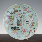 A Chinese pale turquoise ground famille rose dish, 19th century, painted with vases and other