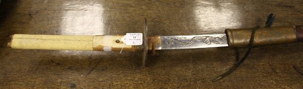 A Japanese sword, with ray skin handle, copper and pewter inset scabbard decorated with dragons, the