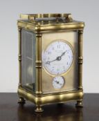 An early 20th century French brass hour repeating carriage alarm clock, with enamelled arabic dial