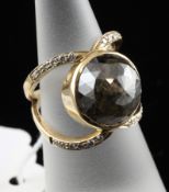 A gold and fancy dark brown diamond set dress ring, the round rose cut stone weighing