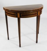 A George III satinwood crossbanded mahogany demi-lune tea table, with tapering square section