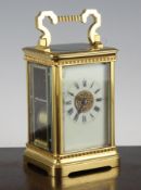 A 20th century French gilt brass carriage clock, with enamelled Roman dial and movement striking