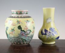 A Chinese yellow glazed jar and cover and a similar pear shaped vase, early 20th century, the jar