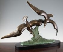 Charles Ruchot. An Art Deco bronzed spelter group of two seagulls flying over a wave, signed, on