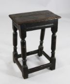 A mid 17th century oak joynt stool, with moulded frieze on ring turned supports, H.1ft 4in.