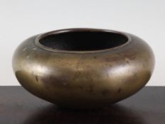 A Chinese bronzed compressed globular censer, 17th / 18th century, the base with cast single