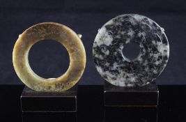 A Chinese jade ring (huan) and a bi disc, the green and brown mottled huan of Liangzhu culture (3,