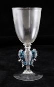 A Facon de Venise winged goblet, 17th century, with twisted hollow stem, blue scroll ornament and