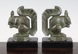 M. Le Verrier. A pair of bronze spelter bookends, modelled as squirrels, signed, on black marble