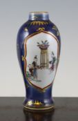 A Chinese blue ground famille rose small baluster vase, Qianlong period, painted to reserves with
