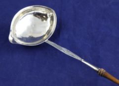 A 19th century continental? silver toddy ladle, with bright cut engraved stem and turned wooden