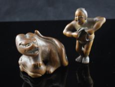 Two Japanese wood netsuke, 19th century, the first carved as a wild cat and cub, horn inset eyes,