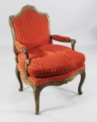 A Régence fruitwood fauteuil, c,1745, with moulded and foliate carved frame, upholstered back,