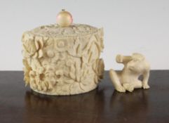 A Japanese ivory box and cover and a monkey figure, Meiji period, the flower carved box with