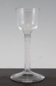 An opaque twist stem wine glass, c.1770, the ogee bowl above a double series stem, on a conical