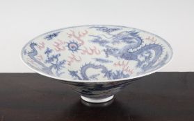 A Chinese blue and white and puce enamelled `dragon` conical bowl, 20th century, 7.8in. (20cm)