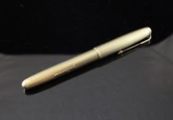 A 1960`s engine turned 9ct gold Parker 51 fountain pen, 5.5in.