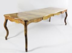 A provincial French oak dining table, of serpentine outline, on scrolling legs, 3ft 1in., L.8ft