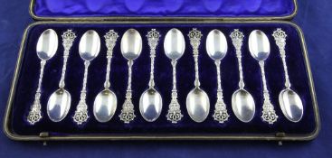 A cased set of twelve Victorian silver coffee spoons, with satyr mask and pierced terminals,