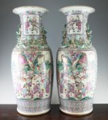 A pair of large Chinese canton decorated famille rose vases, late 19th century, each painted with