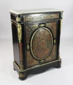 A Napoleon III red boulle work and ebony pier cabinet, with white marble top and ormolu mounts,