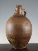 A large German stoneware bellarmine, 17th century, of ovoid form, the neck cast with the typical