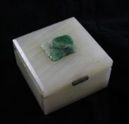 An onyx box with jadeite plaque to the cover, 20th century, the jadeite plaque carved as lotus, with