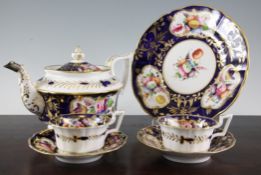 A Coalport twenty four piece teaset, c.1825, each piece painted with flower reserves on a cobalt