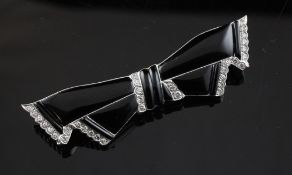 A 1930`s style white gold, onyx and diamond set bow brooch, 2.25in.