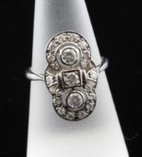 An Art Deco style 18ct white gold and diamond set dress ring, of overlapping circle design,