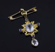 An early 20th century gold, white topaz and sapphire set drop pendant, of lozenge form, suspended