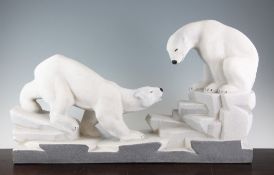 A French Art Deco ceramic group of two polar bears, seated upon ice flows, 24in.