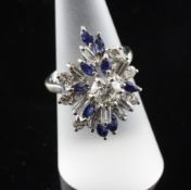 An 18ct white gold, sapphire and diamond set free form cluster dress ring, size N.