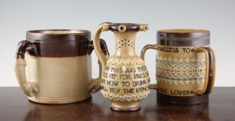 A Doulton Lambeth stoneware tyg, inscribed `Freedom to the Slave, etc`, a Doulton Lambeth puzzle jug